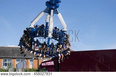Grantham, Lincolnshire, England- July 9, 2022. People At The Stratosfear Thrill Ride. End Of The Rid