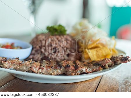 Close Up Of Roast Beef With Gallo Pinto And Pico De Gallo, Nicaraguan Food Served On Wooden Table, P