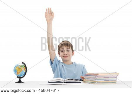 Know-it-all Boy Raised His Hand High In Class. Portrait Of Schoolboy With Notebooks And Textbook In 