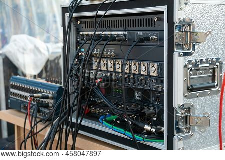 Close Up Audio Snake And Stage Box With Xlr Cables And Jacks At A Live Show