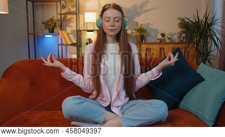 Keep Calm Down, Relax, Inner Balance. Young Redhead Child Girl Breathes Deeply With Mudra Gesture Ey