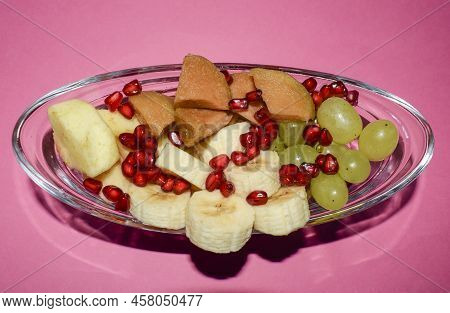 Mix Fruit Salad Chaat Of Sliced Bananas, Grapes, Cut Cheeku, Pear And Apples With Green Grapes. Mix 