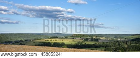 Landscape With Corn Field And Flowers In Belgian Ardennes Near Han Sur Lesse And Rochefort Under Blu