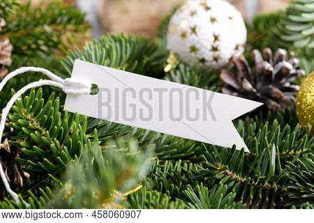 Christmas Rectangle Strip Tag Mockup With White Cord, Close Up On Natural Fir Tree Branch, With Cone