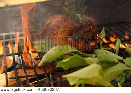 Roast Chicken Barbecue With Lemon Leaves, Outside Private House On A Public Holiday