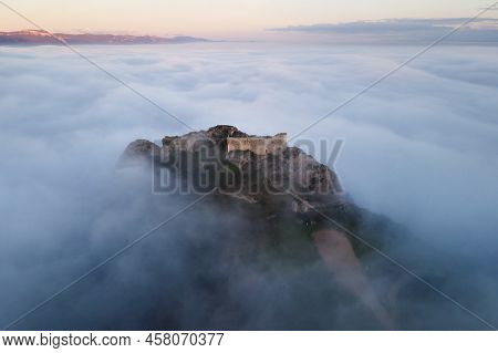 Aerial View Of A Medieval Castle In A Beautiful Foggy Sunset, Poza De La Sal, Burgos, Spain. High Qu