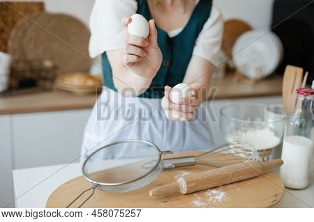 Girl Confectioner Holding Chicken Eggs In Her Hands