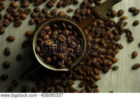 Black Roasted Coffee Beans. Cezva Cup Coffee Glass Rustic Style Turkish Ground Coffee