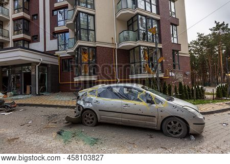 Hostomel, Kyev Region Ukraine - 09.04.2022: Shot Cars. On The Streets Of Irpin. Cities Of Ukraine Af