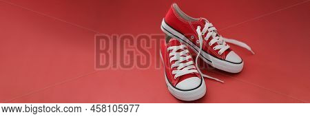 Close-up Of Pair Of Modern Stylish Red Sneaker Shoes, White And Red Colours Mix, New Collection. Foo