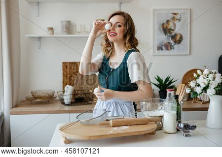 Girl Confectioner Holding Chicken Eggs In Her Hands