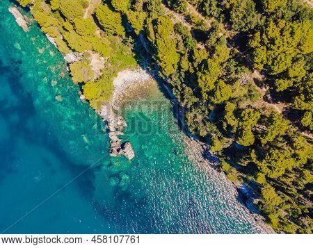 Picturesque Sea Adriatic Coast Of Montenegro. Turquoise Mediteran Sea And Rocky Shore With Evergreen
