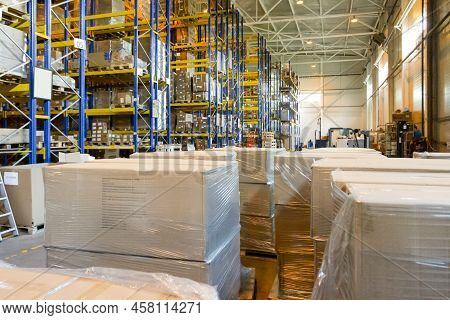 Group Of Boxes In Storehouse. Pallets With Carton Boxes. Interior Of A Modern Warehouse Storage