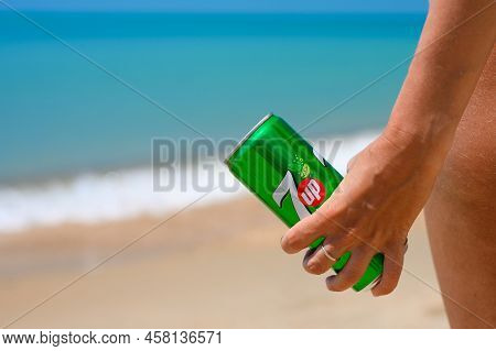 Anapa - Russia, July 2022: Can Of Non-alcoholic Cold Drink 7 Up In The Hand Of A Girl On The Beach. 