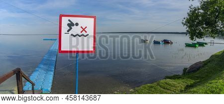 No Diving Sign At Beach, Lake Naroch, Belarus. Warning Sign Of Shallow Water. Warning Notice Sign Do