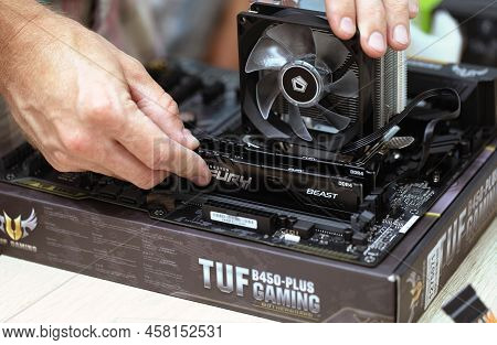 Man Installing Furry Beast Ram Ddr4 Stick And Air Cooling System Of Pc Processor. Pc Assembly And Mo