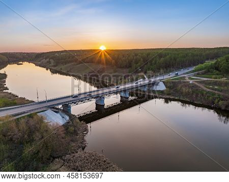 Beautiful View Of The Bridge Across The Iset River In The City Of Kamensk-uralsky At Sunset In Sprin