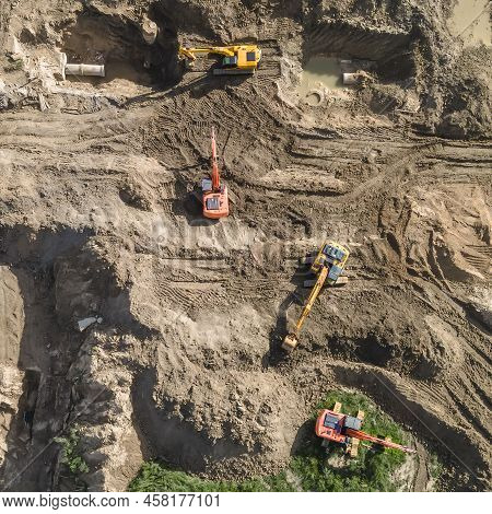 Aerial View Of Excavators On Earthwork At Construction Site. Earthworks During The Install Of Storm 