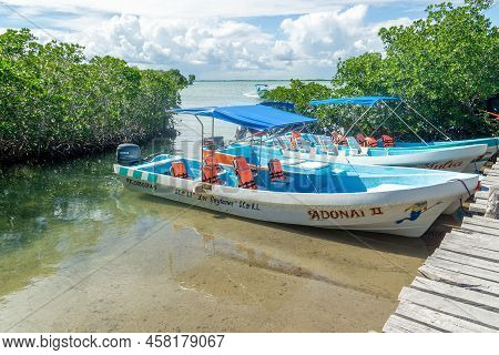 Felipe Carrillo Puerto, Quintana Roo, Mexico - February 06.2022 Motor Boats Are Moored To The Pier A