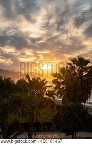 Sunrise Over Sea Water In Torrox Costa, Costa Del Sol, Small Touristic Town Between Malaga And Nerja