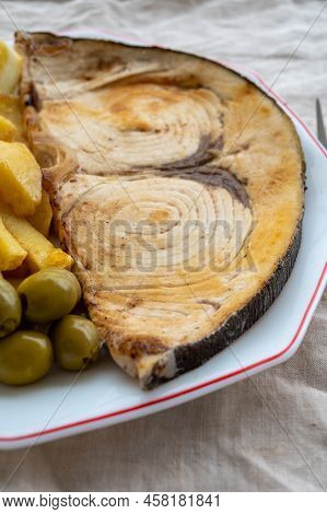 Seafood Dish, Grilled Steak From Swordfish Or Spada Served With French Fried Potatoes And Green Oliv