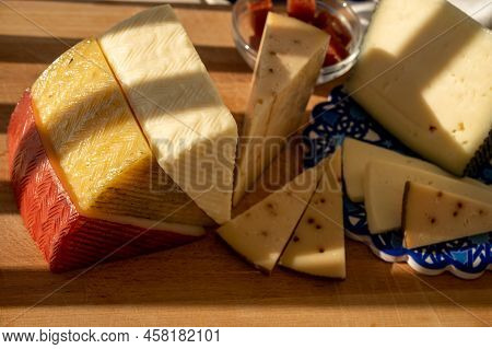 Spanish Hard Manchego, Cow, Sheep And Goat Cheeses Served Outdoor With Membrillo Jam In Sunlights