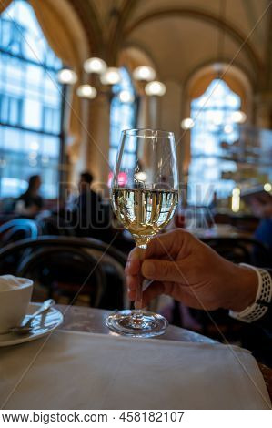 Lifestyle Of Beautiful Vienna, Glass Of White Dry Austrian Wine Served In Old Viennese-style Cafe In