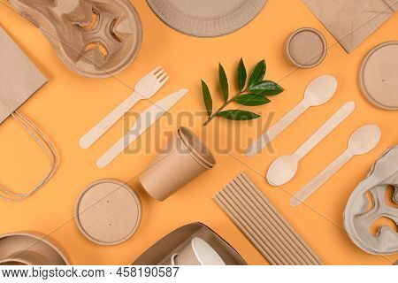 Flat Lay Style Image With Eco-friendly Tableware - Kraft Paper Food Packaging Over Orange Background