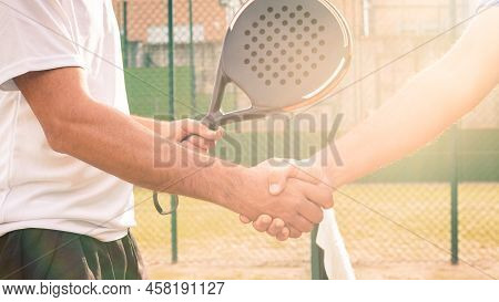 Male Padel Players Handshake After Win Padel Match In Paddel Court Outdoor