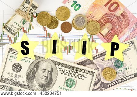 Finance And Economics Concept. Among The Charts And Money Are Asterisks With The Inscription -sipp
