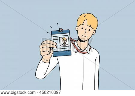 Businessman Present Id Card In Office. Smiling Male Employee Showing Personal Badge At Workplace. St