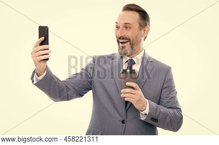 Happy Man Blogger In Suit Meking Selfie On Phone And Drink Coffee Isolated On White, Video Call.