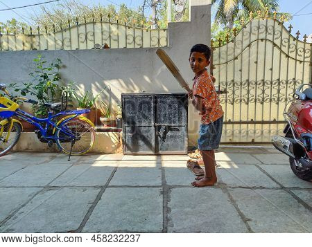 Gulbarga,india- February 15th 2021; Stock Photo Of Indian Kid Wearing Orange Color T Shirt And Short
