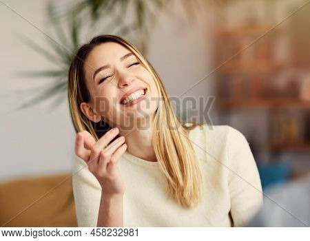 Portrait Of A Young Happy Girl Talking With A Friend
