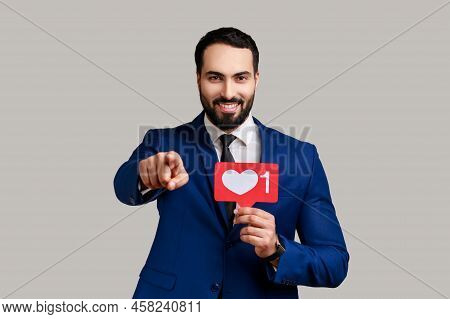 Satisfied Man Holding Heart Like Icon Of Social Media, Notification Button To Follow, Subscribe Blog