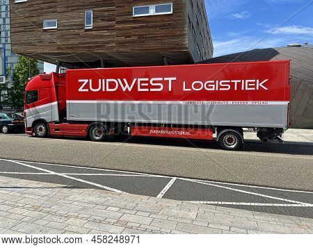 Almere, The Netherlands - July 12, 2022: Red Zuidwest Logistiek Truck Parked By The Side Of The Road