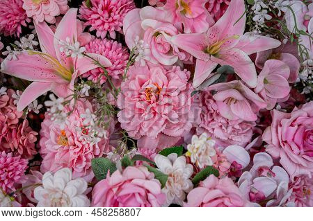 Big Bouquet Of Flowers In A Vase On A Gray Wall Background