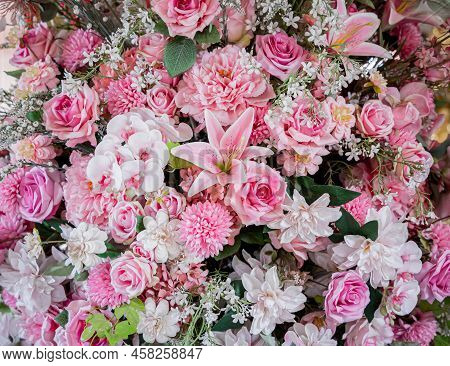 Big Bouquet Of Flowers In A Vase On A Gray Wall Background