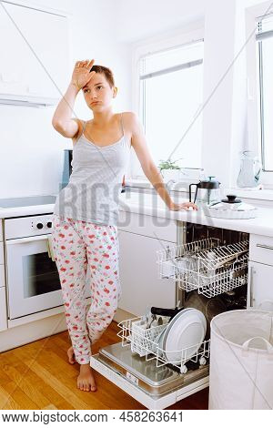 Teenage Girl With Short Hair, In Home Clothes, Clutched Head From Fatigue From Home Routine. Filled 