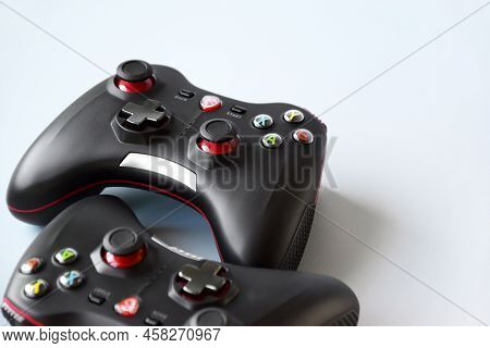 Two Msi Joystick Gaming Controller On Light Blue Background.