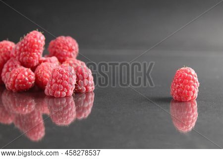 Raspberries Lie In A Stack Of Piles On A Black Background Close-up. Day Berries Health Raspberries F