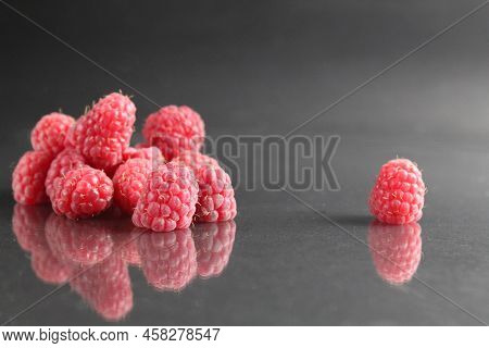 Raspberries Lie In A Stack Of Piles On A Black Background Close-up. Day Berries Health Raspberries F