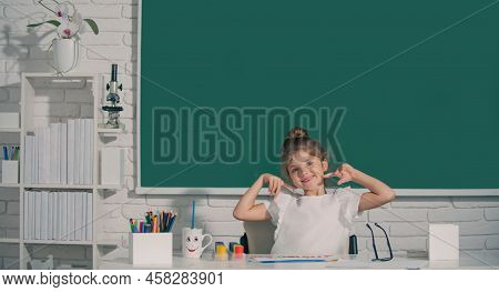 Child Girl Drawing With Coloring Pens Paintind. Portrait Of Adorable Little Girl Smiling Happily Whi