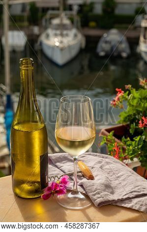 Drinking Of Cold White Wine  With View On Yacht Harbour Of Port Grimaud, Summer Vacation On French R