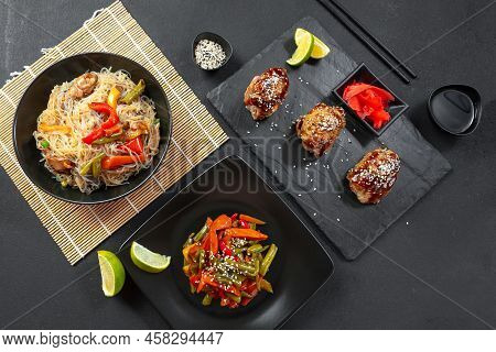 A Variety Of Asian Food On A Dark Concrete Background. Asian Food. Fast Food Street Food.