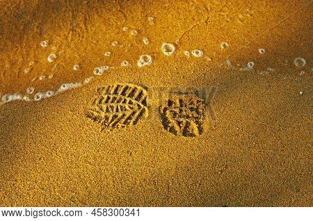 Bootprint Of The Shoe On The Sandy Beach.
