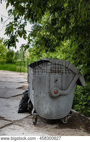 Trash Can On Wheels With Open Lid. High Quality Photo