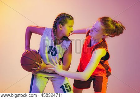 Attack And Defense. Female Basketball Players, Young Girls, Teen In Action With Basketball Ball Isol