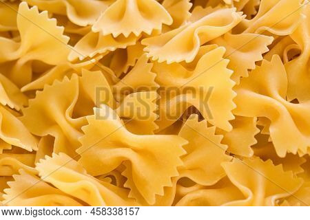 Texture Of Dry Italian Pasta Pasta Farfalle. Italian Cuisine Products. Products From Durum Flour