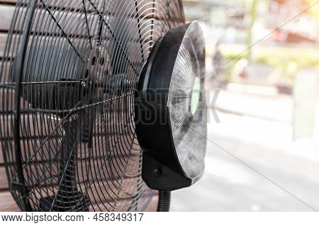 Close-up Detail View Of Fresh Moisturized Breeze Air Blowing From Big Cooling Fan Machine Hot Sunny 